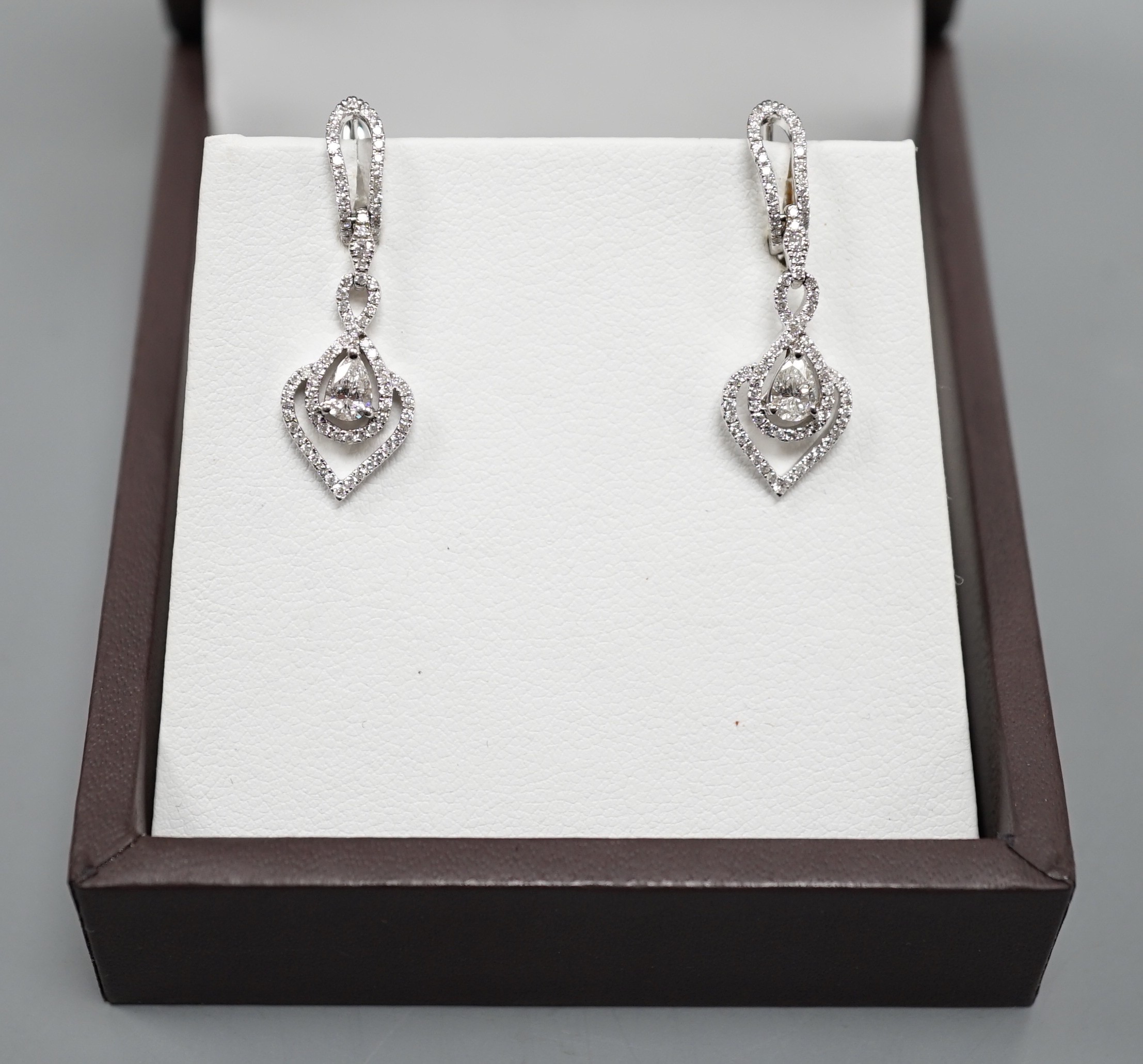 A pair of modern Kobelli 14k white metal and diamond cluster heart shaped drop earrings, with central pear cut stone, 28mm, gross weight 4.6 grams.